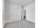Bedroom with gray carpeting, double door closet, and access to a staircase at 5759 Cr W 750 N, McCordsville, IN 46055