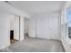 Spacious bedroom with grey carpet, two doors and a window at 5759 Cr W 750 N, McCordsville, IN 46055