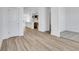 Hardwood floor living room with kitchen and carpeted nook at 5759 Cr W 750 N, McCordsville, IN 46055