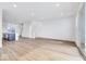 Spacious living room with hardwood floors, kitchen, and staircase at 5759 Cr W 750 N, McCordsville, IN 46055