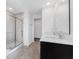 Bathroom featuring double sink vanity, glass enclosed shower, and tiled shower surround at 475 Chester Ln, Pittsboro, IN 46167