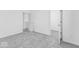 Bedroom featuring neutral carpeting and doorway access to a closet and bathroom at 475 Chester Ln, Pittsboro, IN 46167