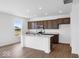 New kitchen featuring stainless steel appliances, light countertops, and an island with seating at 475 Chester Ln, Pittsboro, IN 46167