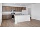 Modern kitchen featuring stainless steel appliances, marble countertops, and a functional island at 475 Chester Ln, Pittsboro, IN 46167