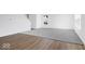 Open living room featuring a seamless blend of wood flooring and new carpeting at 475 Chester Ln, Pittsboro, IN 46167