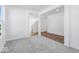 Open living area featuring plush carpet, smooth flooring, and access to other areas at 475 Chester Ln, Pittsboro, IN 46167