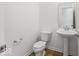 A clean powder room with a pedestal sink and modern fixtures at 475 Chester Ln, Pittsboro, IN 46167