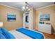 Bright bedroom with a walk-in closet and tranquil wall art at 7709 Elk Dr, Nineveh, IN 46164