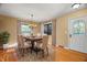 Bright dining room features hardwood floors and chandelier at 7709 Elk Dr, Nineveh, IN 46164