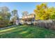 Charming two-story house with a wraparound porch, nestled on a spacious grassy lot at 7709 Elk Dr, Nineveh, IN 46164