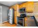 Kitchen boasts stainless steel appliances and ample cabinetry at 7709 Elk Dr, Nineveh, IN 46164