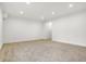 A large room with neutral carpet, recessed lighting, and a wide entryway, perfect for flexible living at 860 Chatham Hills Blvd, Westfield, IN 46074