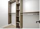 Walk-in closet features custom wood organizers with shelving and hanging rods at 860 Chatham Hills Blvd, Westfield, IN 46074