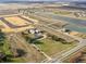 Aerial view of planned community development featuring homes, ponds, and recreational areas at 1217 Fleming Dr, Greenfield, IN 46140
