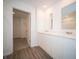 Modern bathroom with double sinks, quartz counters, and access to a walk-in closet at 1217 Fleming Dr, Greenfield, IN 46140