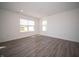A bright, airy bedroom featuring wood-look floors and a large window for ample natural light at 1217 Fleming Dr, Greenfield, IN 46140