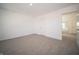 Neutral carpeted bedroom with white walls and a view of a bright window at 1217 Fleming Dr, Greenfield, IN 46140