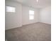 Neutral carpeted bedroom with light-filled windows and white walls at 1217 Fleming Dr, Greenfield, IN 46140