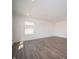 Bright bedroom featuring wood floors, recessed lighting, and a window with blinds offering natural light at 1217 Fleming Dr, Greenfield, IN 46140