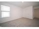 Bright bedroom with carpet, white walls, and a view of a bright window at 1217 Fleming Dr, Greenfield, IN 46140