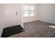 Bright entryway with wood-look floors, a fresh white door and trim, and ample natural light at 1217 Fleming Dr, Greenfield, IN 46140