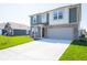 A charming two-story home with a spacious driveway and well-maintained lawn, ideal for suburban living at 1217 Fleming Dr, Greenfield, IN 46140