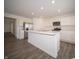 Modern kitchen featuring stainless steel appliances, marble countertops, and a center island with a sink at 1217 Fleming Dr, Greenfield, IN 46140