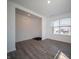 Bright living room with wood-look floors and large windows, creating a welcoming atmosphere at 1217 Fleming Dr, Greenfield, IN 46140