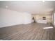 Open-concept living room showcases hardwood floors and adjoins a modern kitchen with stainless steel appliances at 1217 Fleming Dr, Greenfield, IN 46140