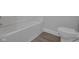 Clean bathroom featuring a bathtub and toilet at 405 E 9Th St, Sheridan, IN 46069