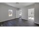 Simple bedroom with gray walls, dark floors and ample natural light at 405 E 9Th St, Sheridan, IN 46069