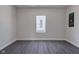 Simple bedroom with grey flooring and a window at 405 E 9Th St, Sheridan, IN 46069