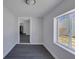 Bright dining room with gray walls and dark gray floors at 405 E 9Th St, Sheridan, IN 46069