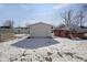 Detached garage in snowy backyard at 405 E 9Th St, Sheridan, IN 46069