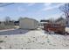 Detached garage in snowy backyard at 405 E 9Th St, Sheridan, IN 46069