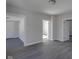 Bright hallway with gray walls and dark gray floors at 405 E 9Th St, Sheridan, IN 46069