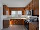 Renovated kitchen featuring stainless steel appliances and wood cabinets at 405 E 9Th St, Sheridan, IN 46069