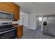 Modern kitchen with stainless steel appliances and wood cabinets at 405 E 9Th St, Sheridan, IN 46069