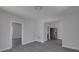 Open living room with gray walls and dark gray floors at 405 E 9Th St, Sheridan, IN 46069