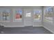 Sunroom with backyard view and access to deck at 405 E 9Th St, Sheridan, IN 46069