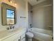 Modern bathroom with tiled shower, bathtub and contemporary vanity at 460 W Smoky Row, Carmel, IN 46032