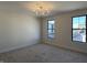 Bright bedroom with large windows and contemporary chandelier at 460 W Smoky Row, Carmel, IN 46032