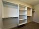 Walk-in closet features custom shelving and ample storage space at 460 W Smoky Row, Carmel, IN 46032