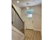 Inviting entryway with hardwood floors and modern light fixture at 460 W Smoky Row, Carmel, IN 46032