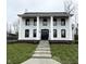 Stunning two-story white brick home with black columns at 460 W Smoky Row, Carmel, IN 46032