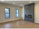 Open living room with a modern fireplace feature wall and large windows for natural light at 460 W Smoky Row, Carmel, IN 46032