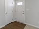 Bright entryway with white doors and dark wood flooring at 1323 Salisbury Dr, Greenfield, IN 46140