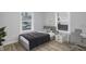 Cozy bedroom featuring a bed, nightstand and ample window light at 1327 N Gale St, Indianapolis, IN 46201