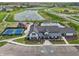 Aerial view showcases community amenities, including clubhouse, pool, and tennis court at 236 Sam Himsel Way, Danville, IN 46122
