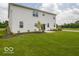 Wide open backyard featuring lush green grass and landscaping, creating a serene outdoor space at 236 Sam Himsel Way, Danville, IN 46122
